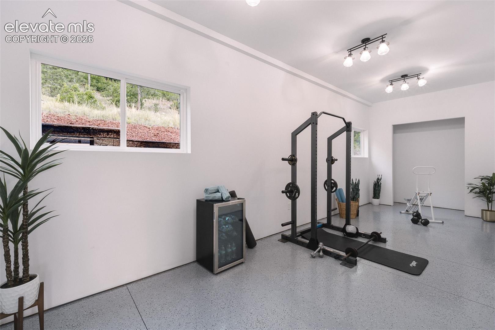 Flex Room off the garage that can be used as a gym, workshop, storage, or man cave.