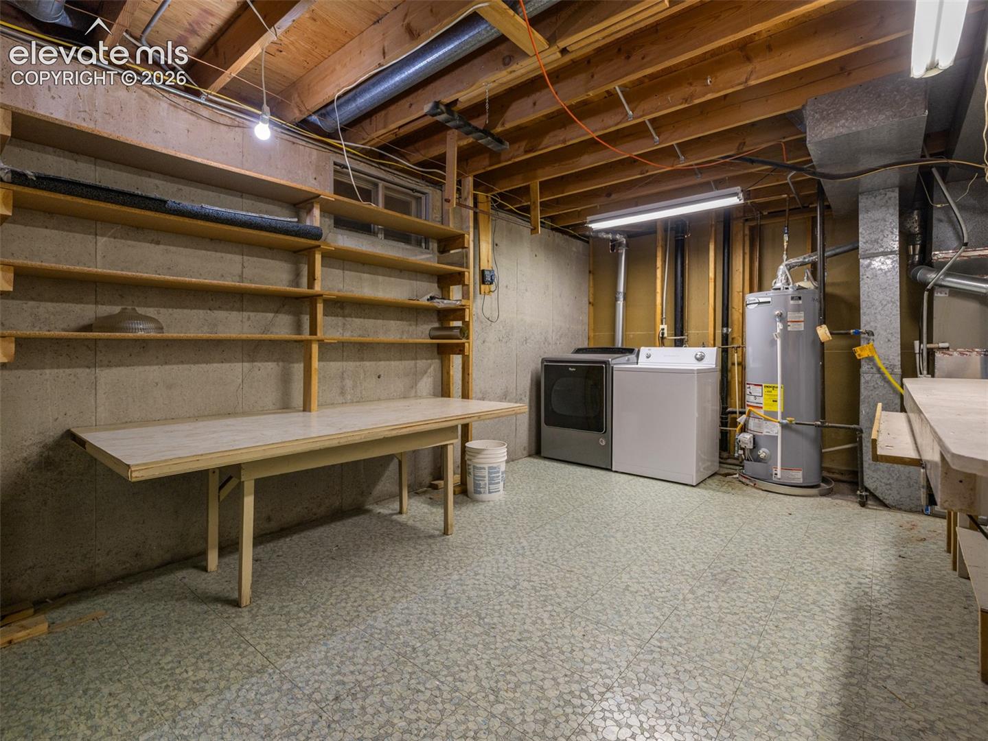 Laundry and Utility room, lots of storage and folding table.