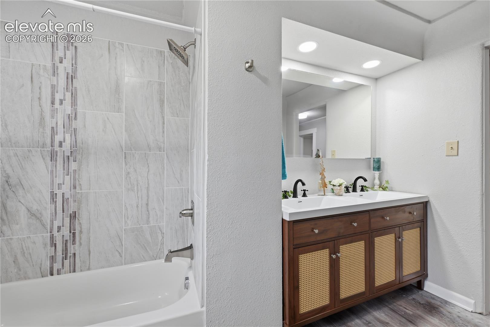 A newly remodeled full bathroom with custom tile.