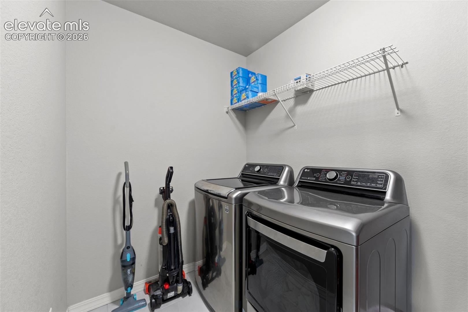 Laundry area featuring a built-in wire shelf