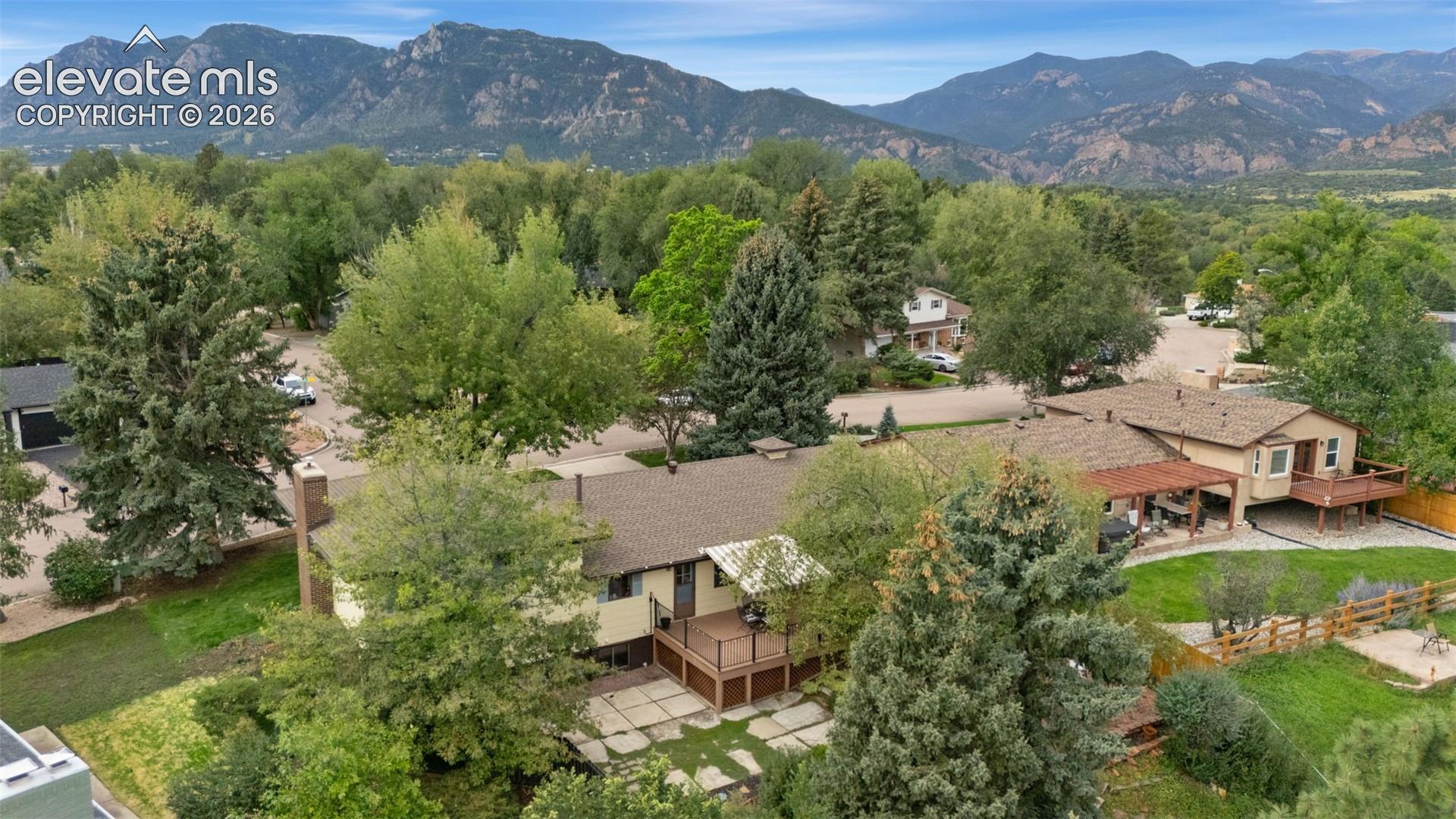 View of back yard showing Trex deck and mature trees