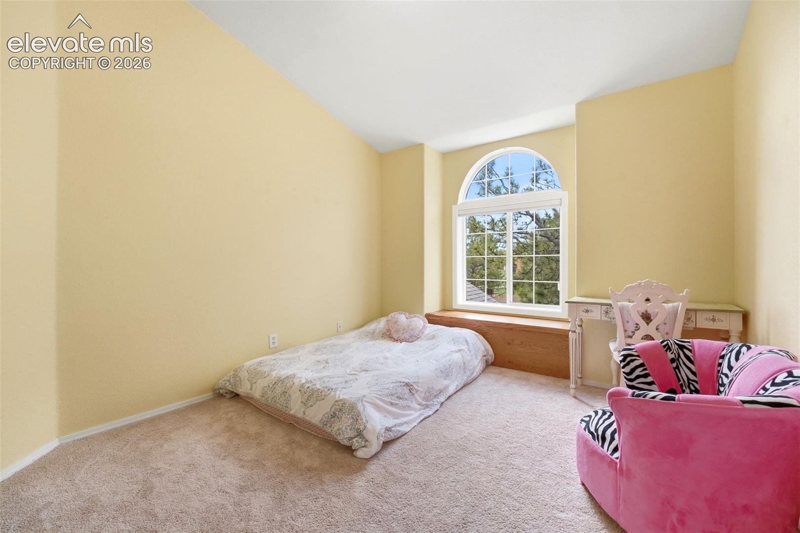 Arch-top window with a wood-finish window seat