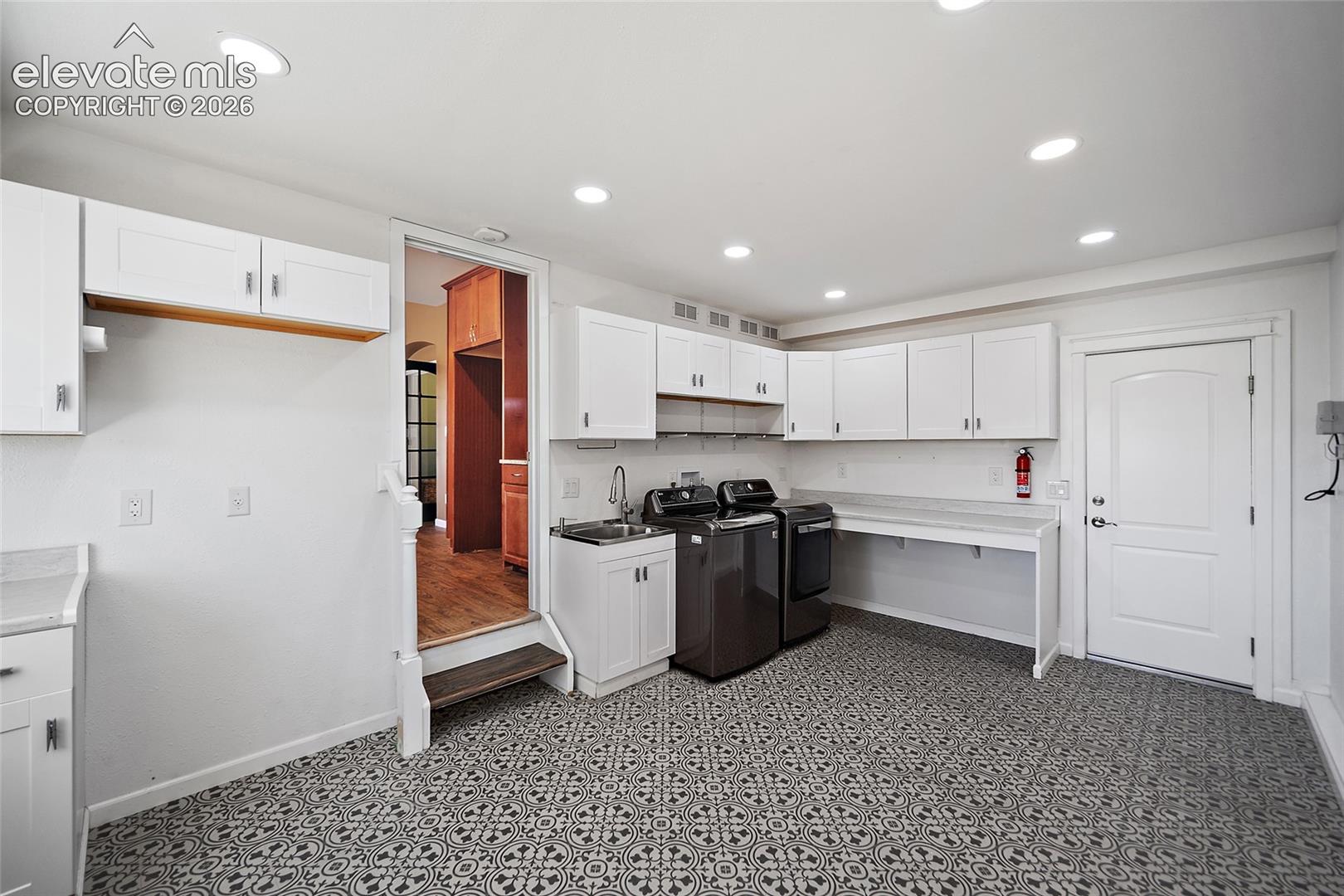 Tandem Garage was converted to a utility/laundry room