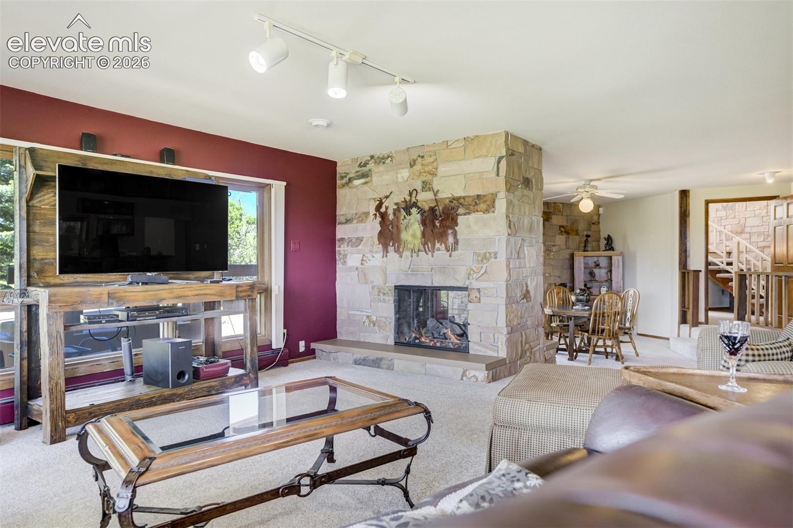 Family room entertainment area with see through fireplace.