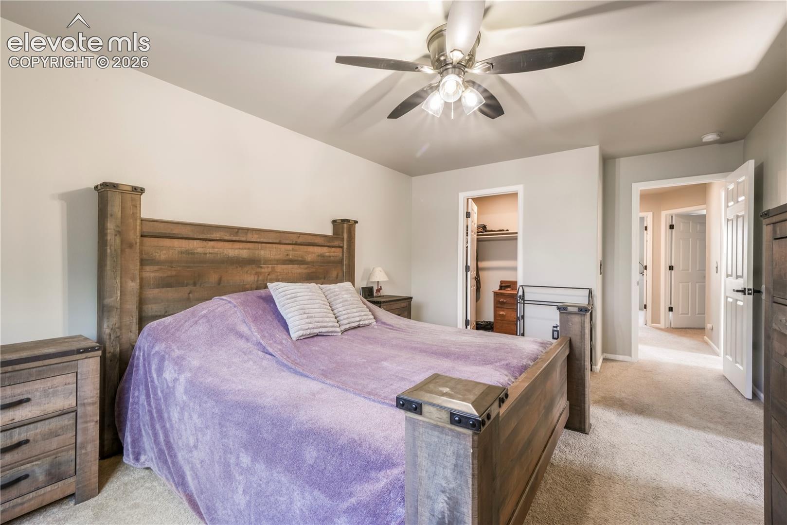 Upstairs Primary bedroom with views of Pikes Peak, 2 closets and updated bathroom