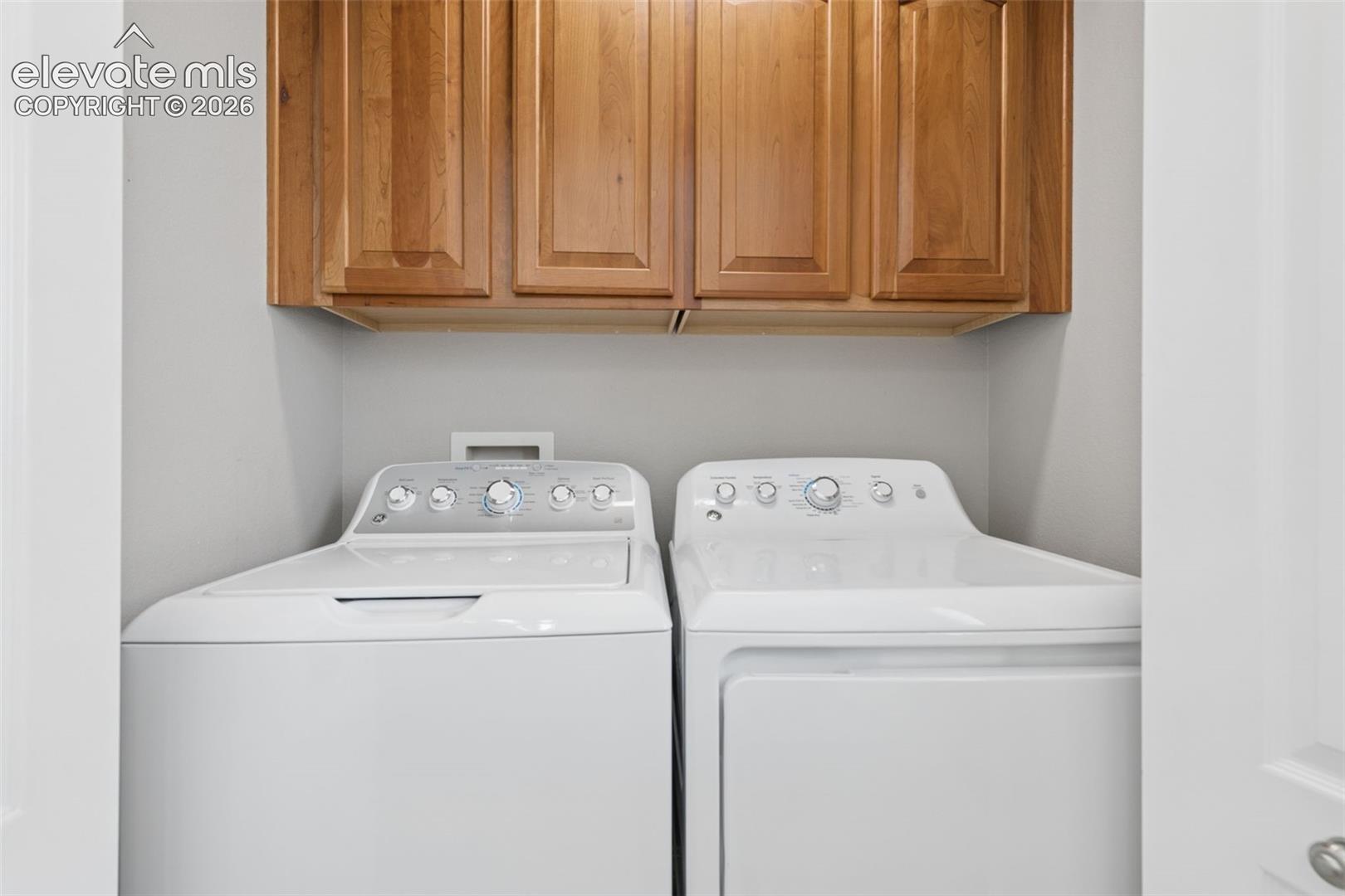 Upper cabinetry with wood-finish doors