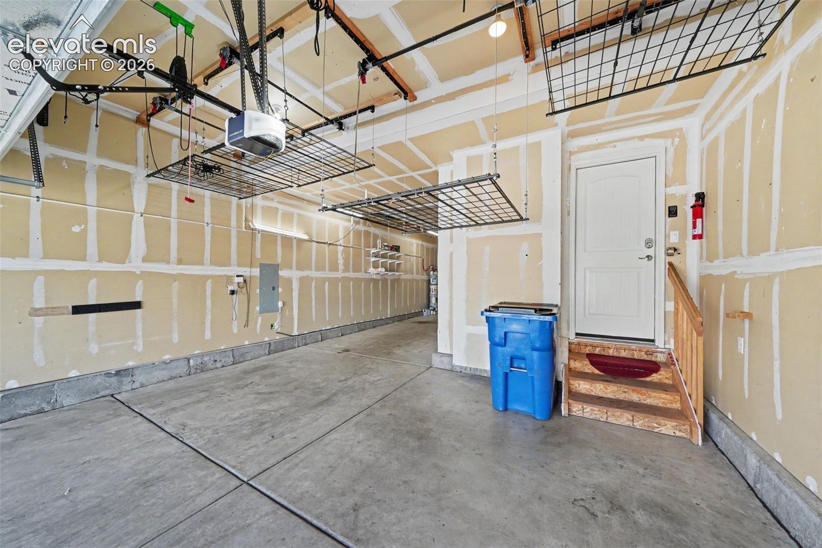 Fully Dry Walled Tandem Garage with Adjustable Suspended Storage Racks