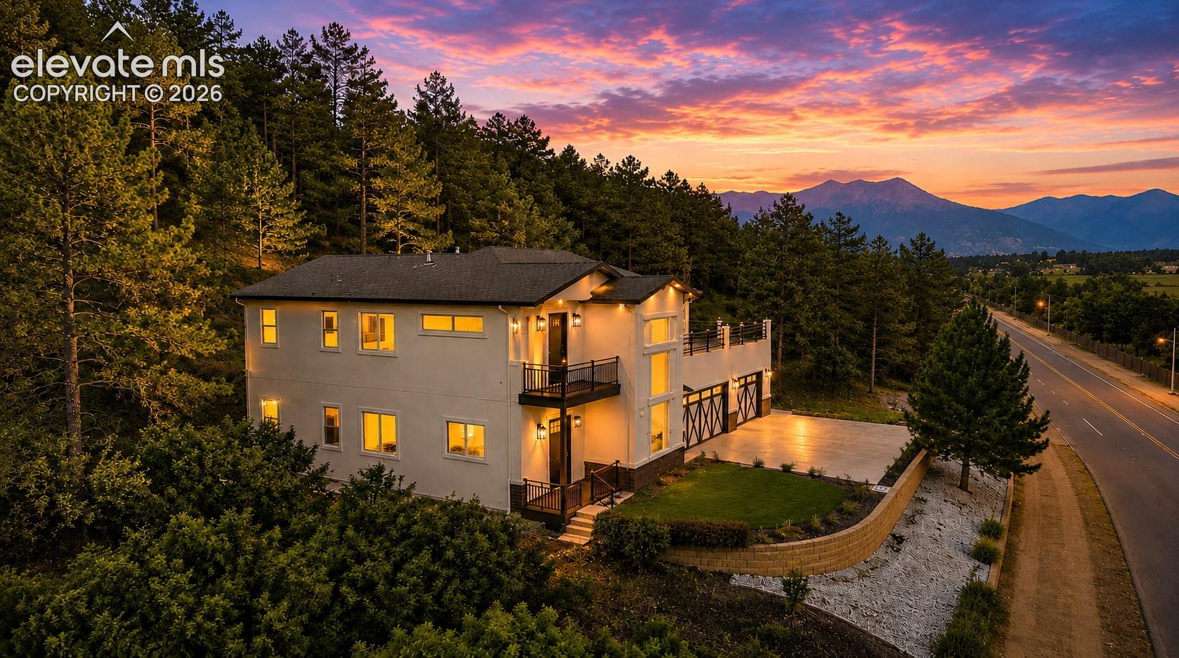 house is perched on a hillside with stunning views