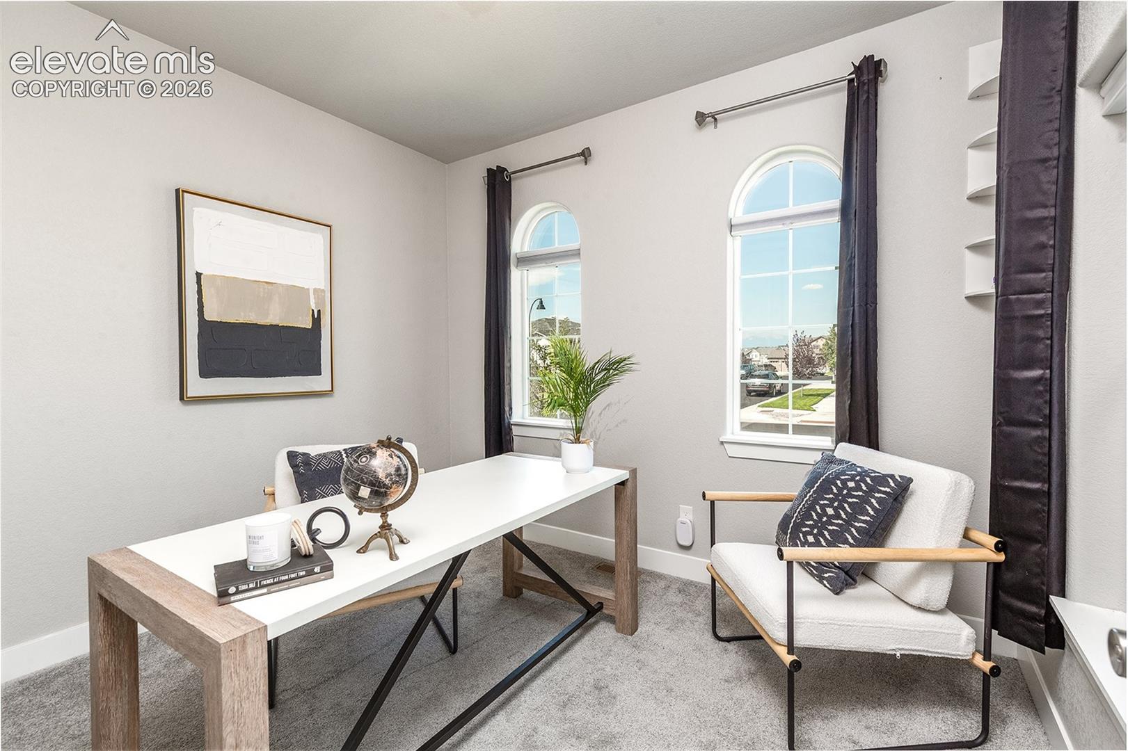 Main level bedroom. Currently staged as an office.