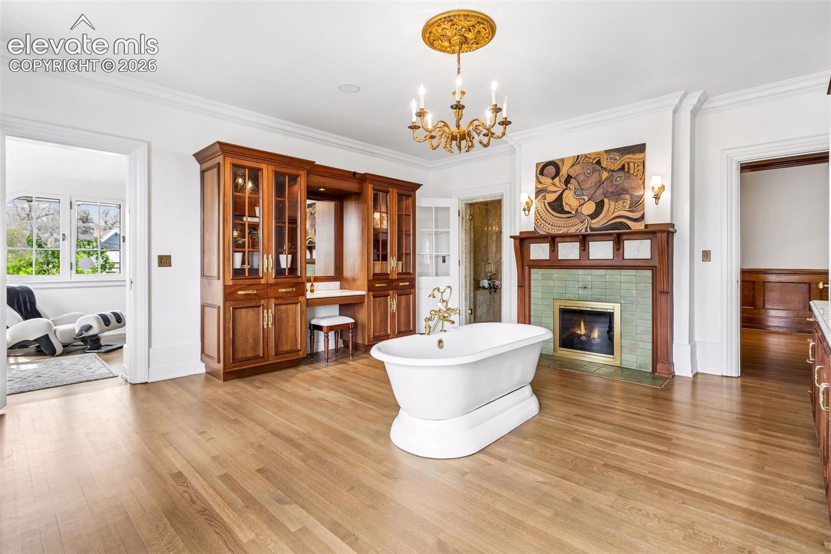 Primary suite bathroom, soaking tub, steam room and 4 of seven Van Briggle fireplaces.