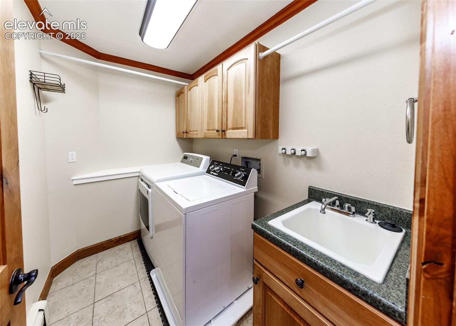 Laundry room main level with a sink
