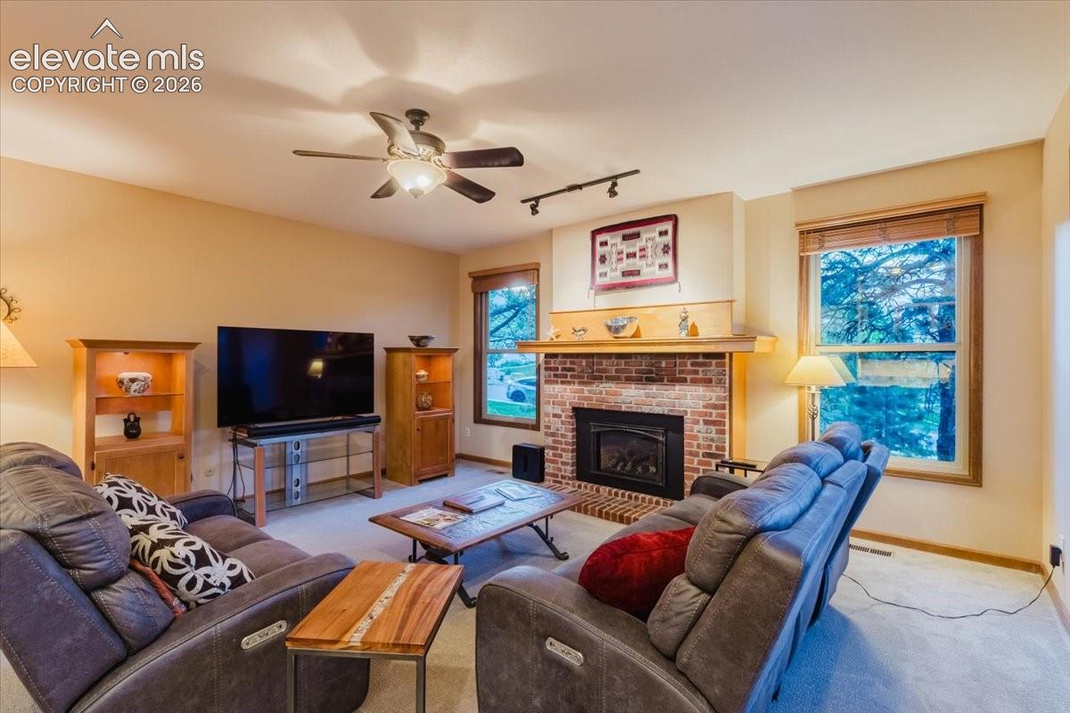 Brick fireplace with a wood mantle and hearth
