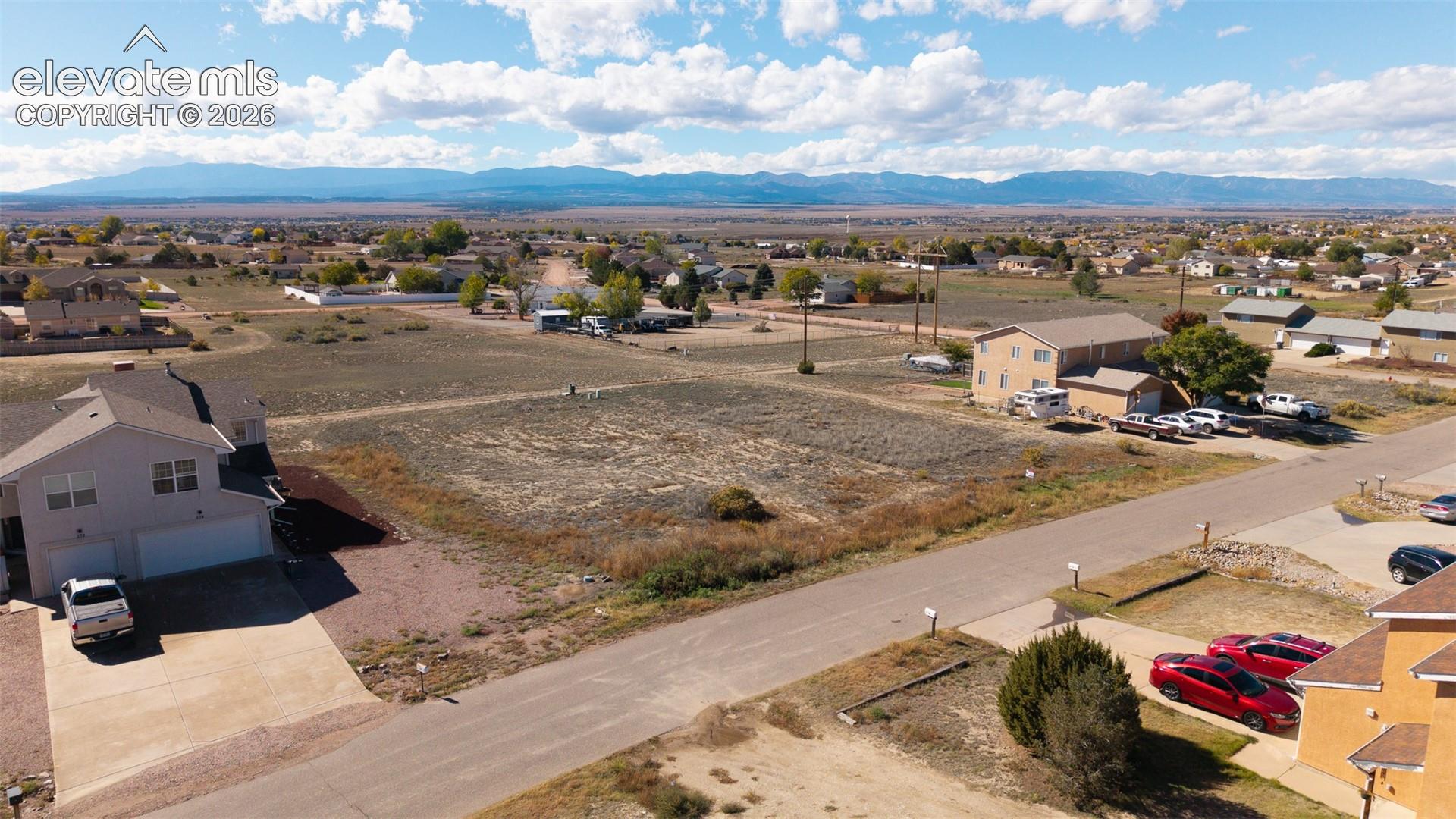 Expansive vacant lot featuring prominent mountain and horizon backdrops