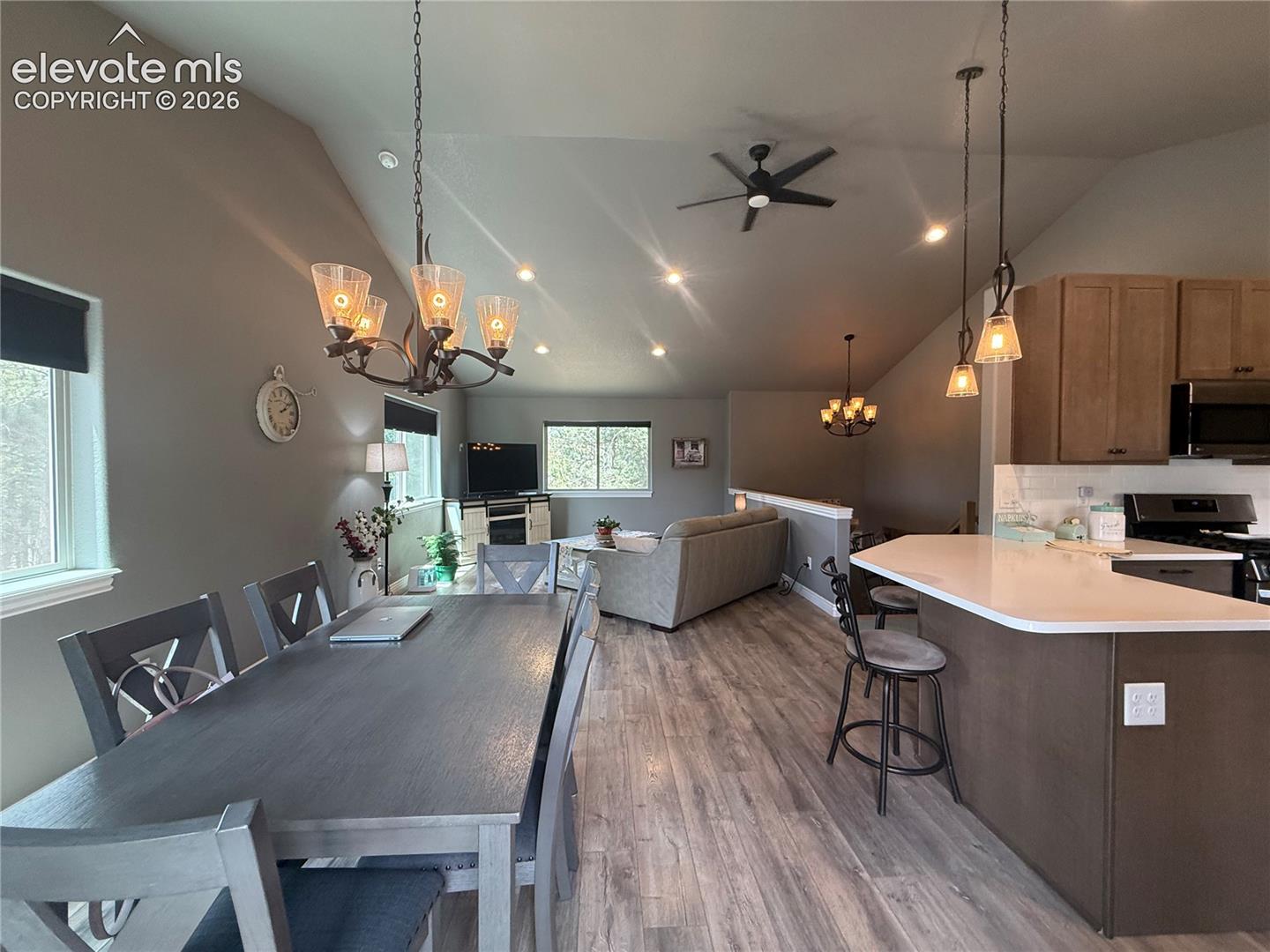 Open concept, dining, living and kitchen vaulted ceilings