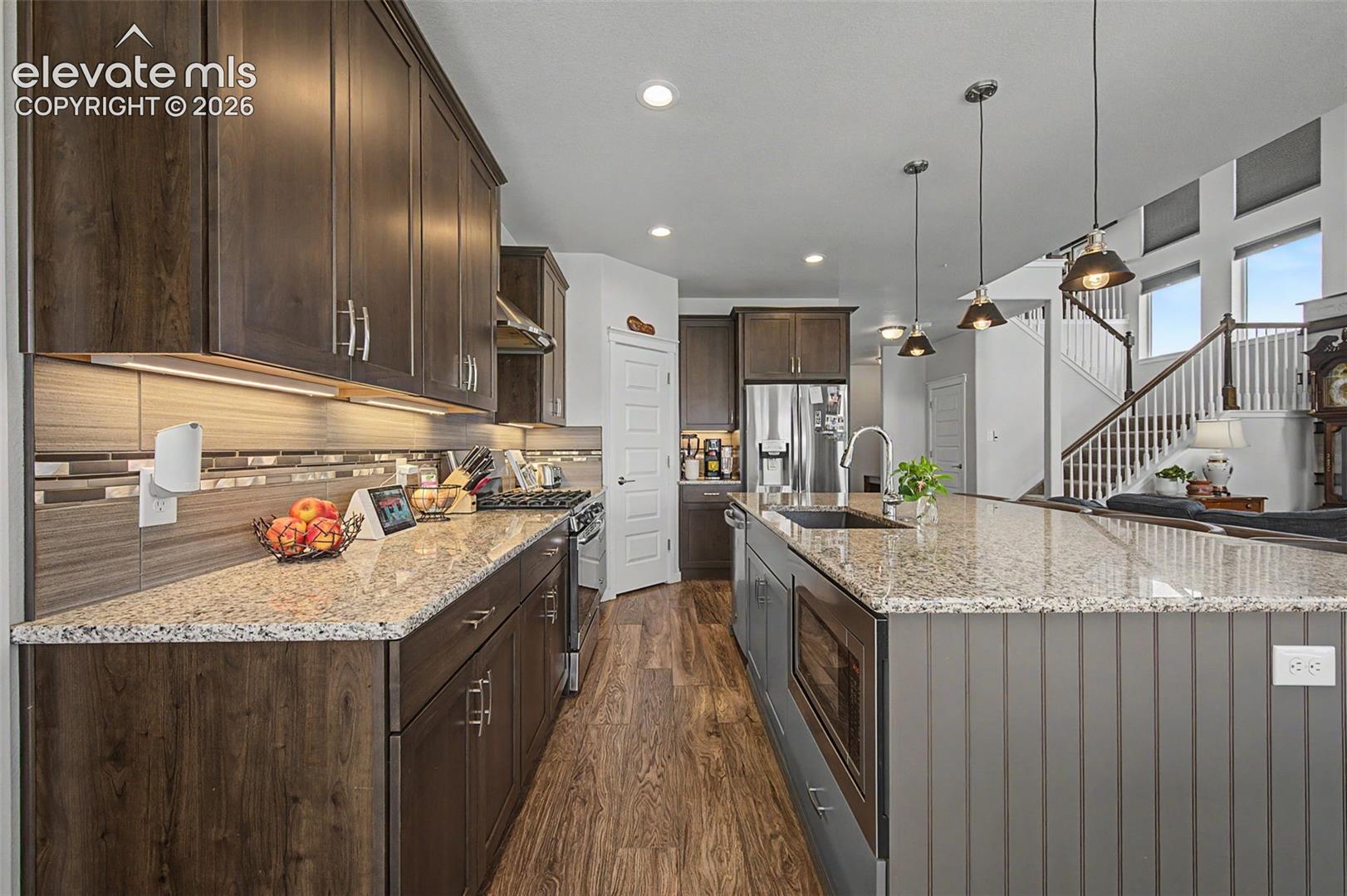 Such an attractive kitchen! All of the appliances stay.