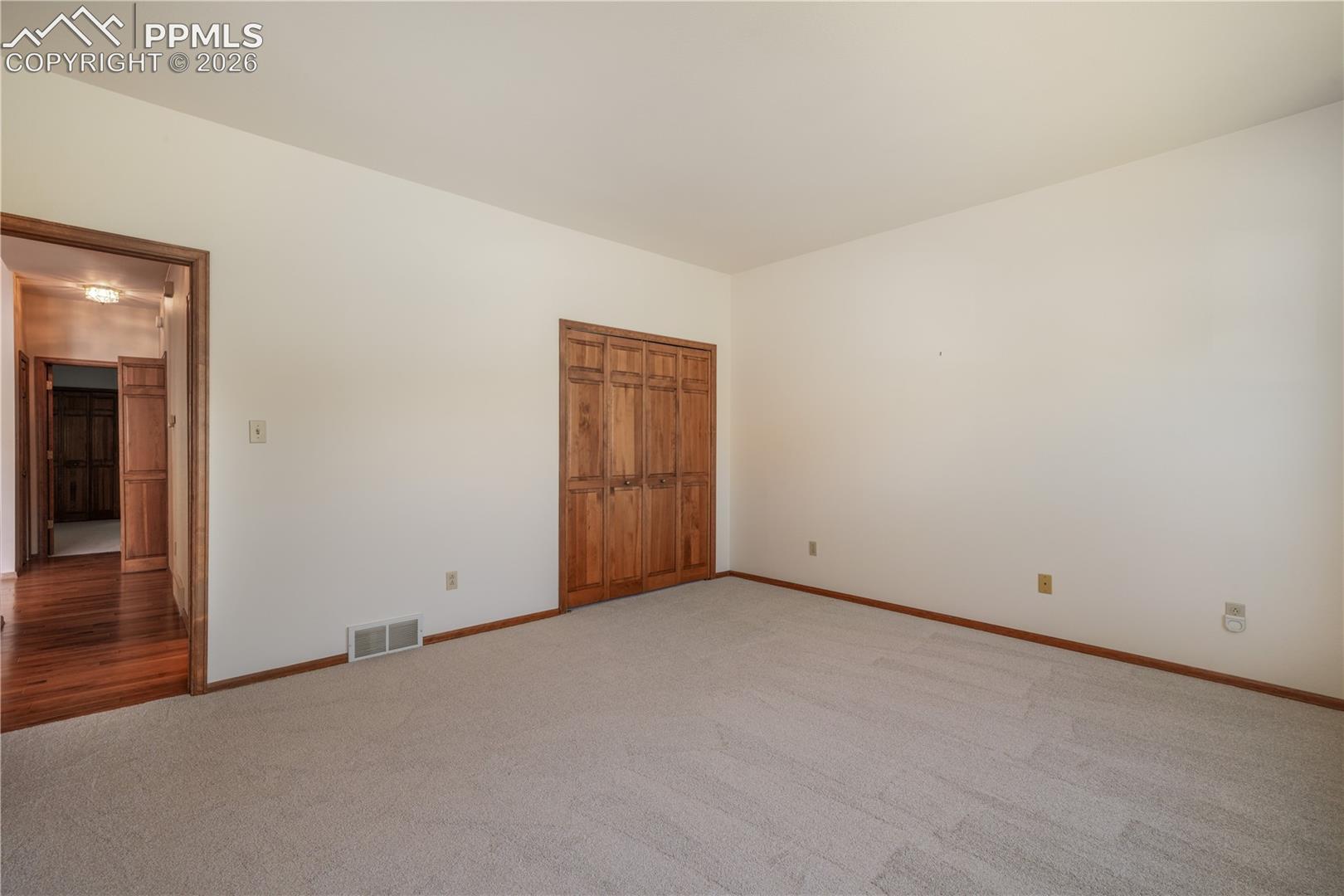 Main floor 2nd bedroom with new carpet