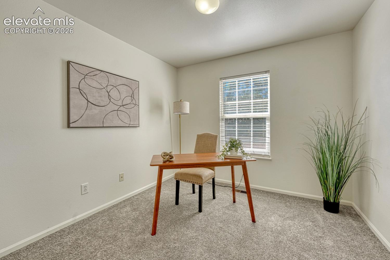 Bedroom #1 (currently an office) with new carpet.