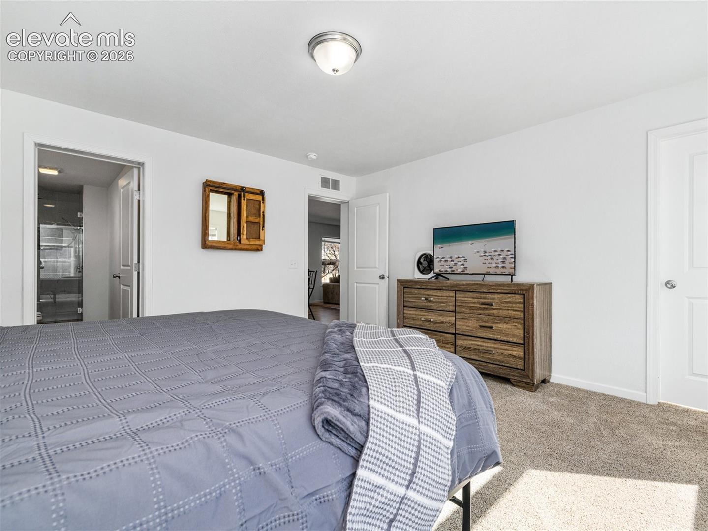 Large primary bedroom with walk in closet