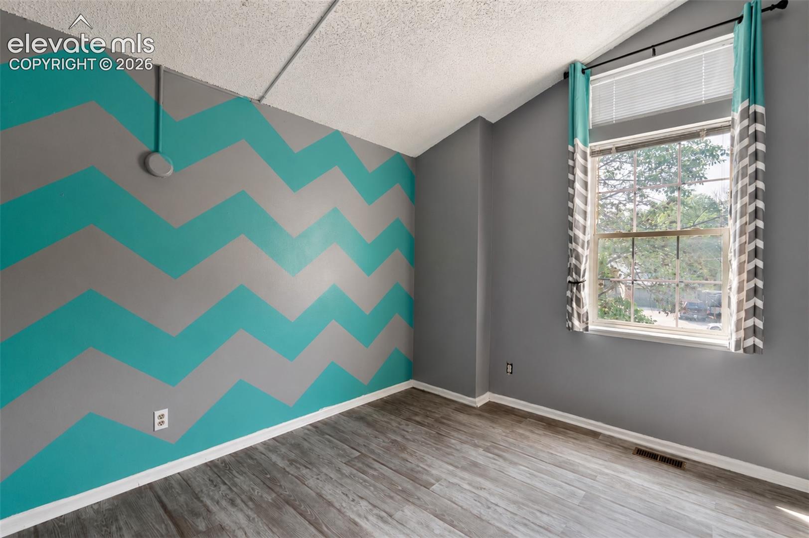 1st Upstairs Bedroom with View to Front Yard.