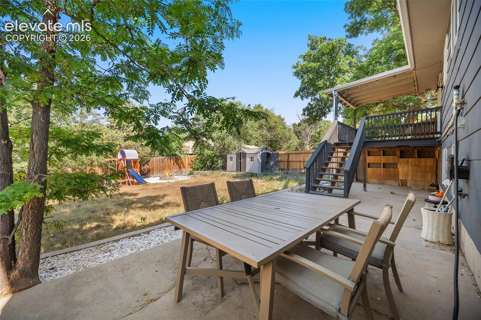 Patio with vews of the spacious backyard.