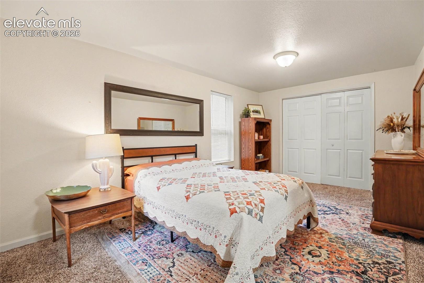 Private master bedroom is tucked away and private