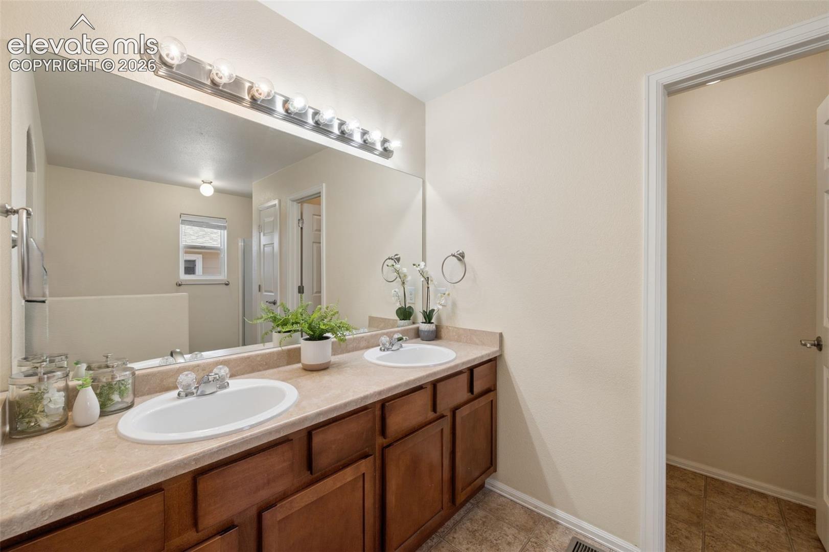 Primary Bedroom En-Suite With Double Sink
