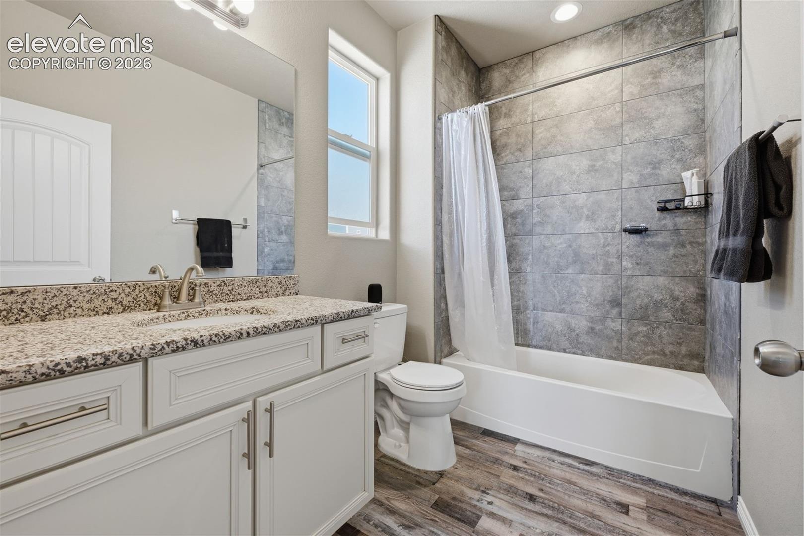 Private Upper-Level Full Bath Serving One of the Secondary Bedroom Suites