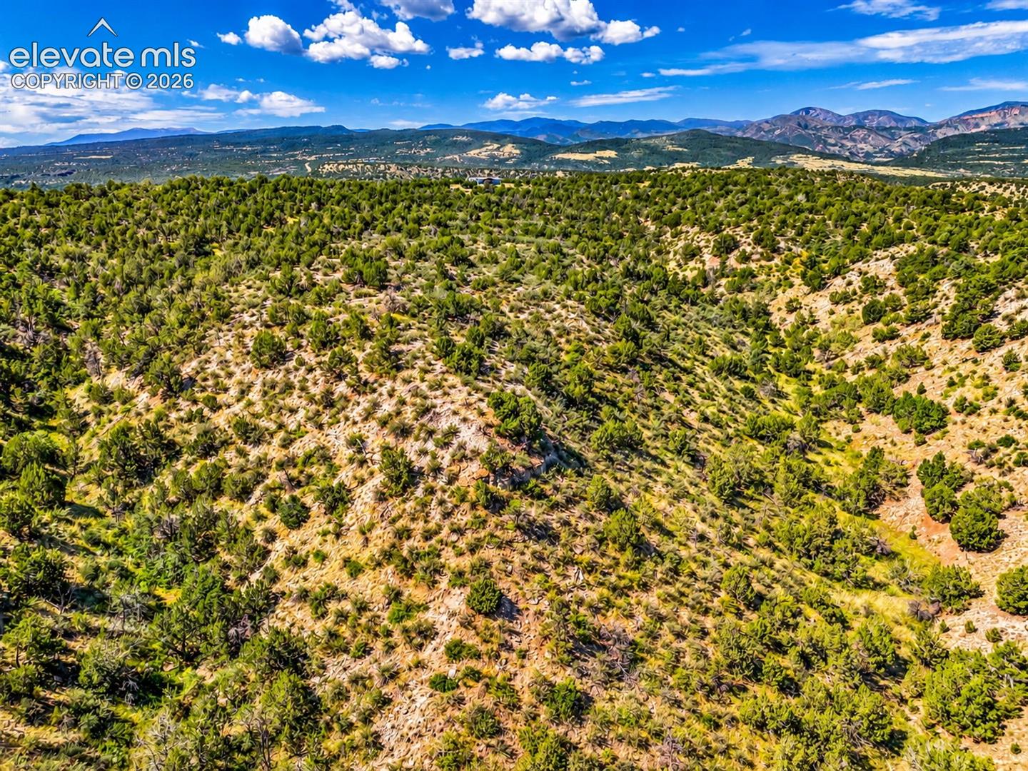 Explore the natural beauty of this 40-acre parcel, featuring rolling hills, rocky terrain, and abundant juniper trees, with sweeping views of the surrounding mountain ranges.

