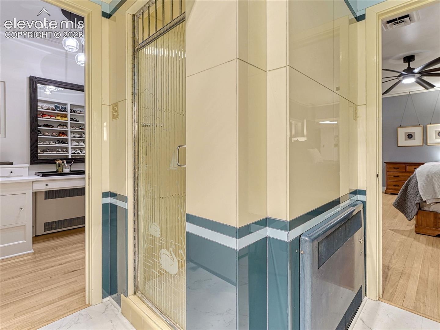 Original glass shower door, viitrolite tile and preserved period details