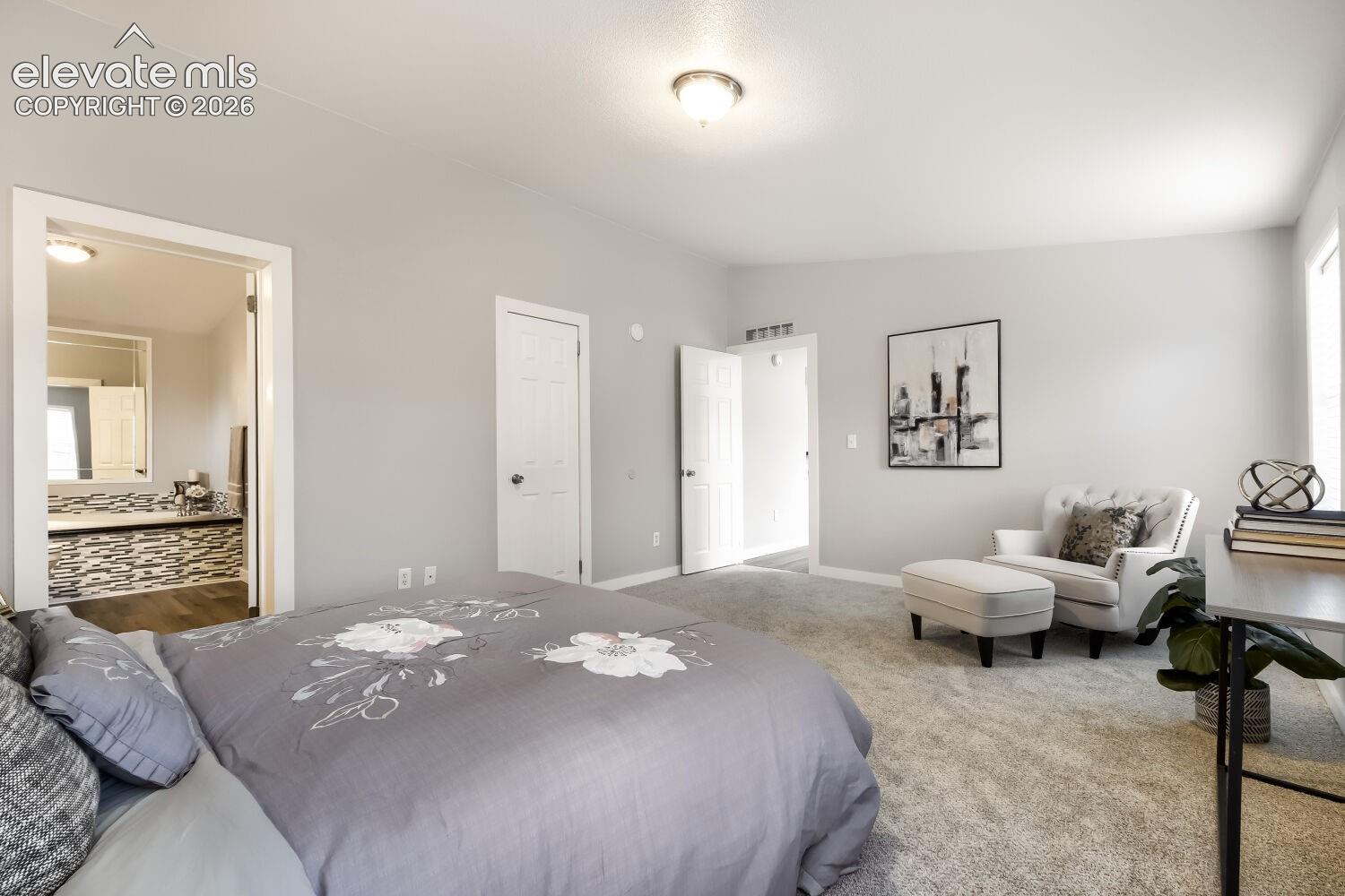 Neutral-toned interior featuring wall-to-wall carpeting, flush-mount lighting, and solid-core interior doors