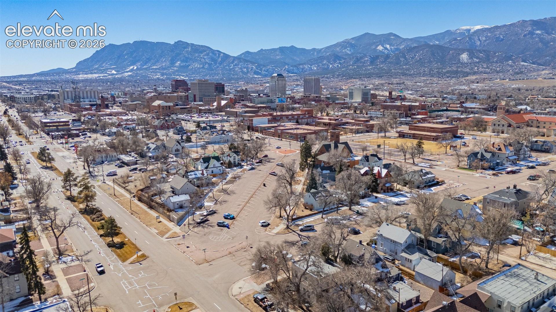Drone / aerial view with a mountain view and a city view