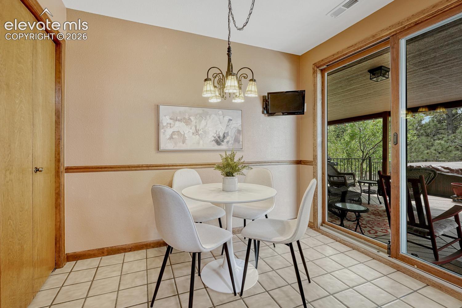 The Dining Nook is located off the Kitchen for informal dining and opens to the backyard deck for comfortable indoor/outdoor dining.