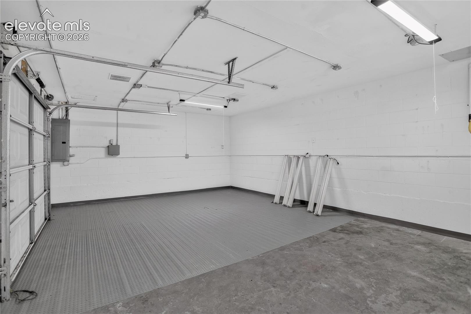Secondar store room with garage door access