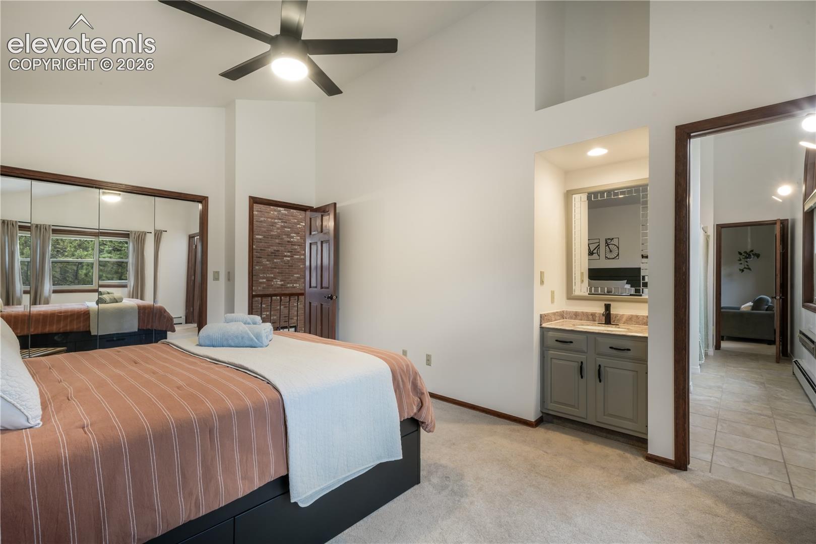 Adjoins to shared full bathroom with designated sink