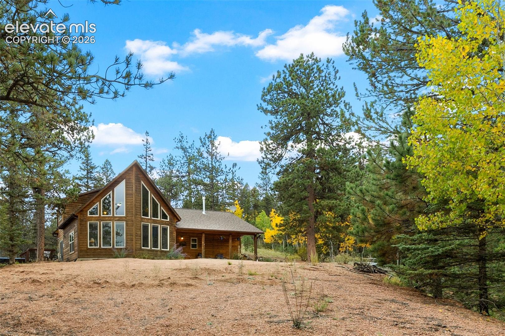 Wood-sided residence with an A-frame architectural style
