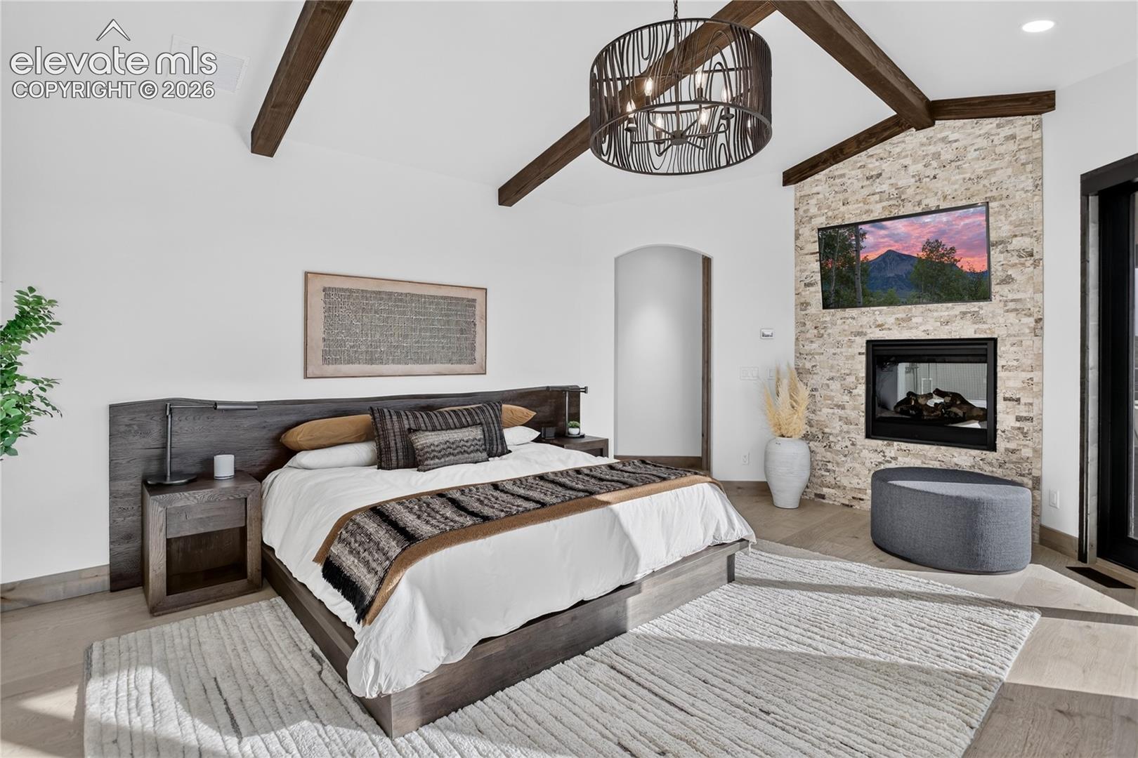 Main level primary suite w/ walk-out & dual sided fireplace