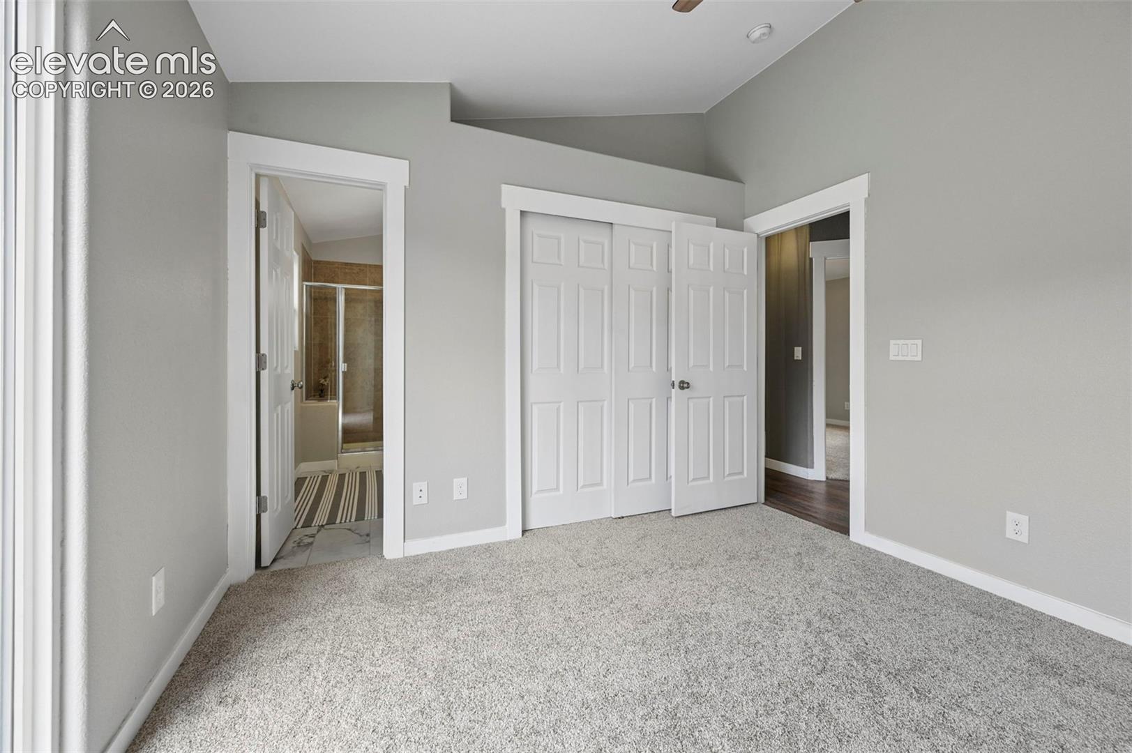 Vaulted ceiling, wall-to-wall carpeting, attached bathroom and closet