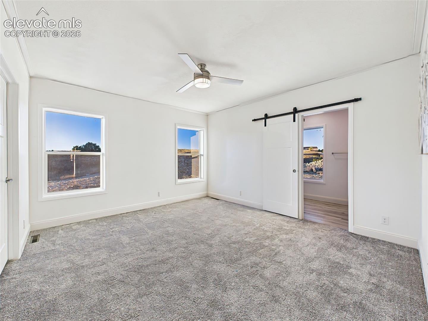 Un staged version showing clean lines, neutral tones, and dual windows for soft morning light.