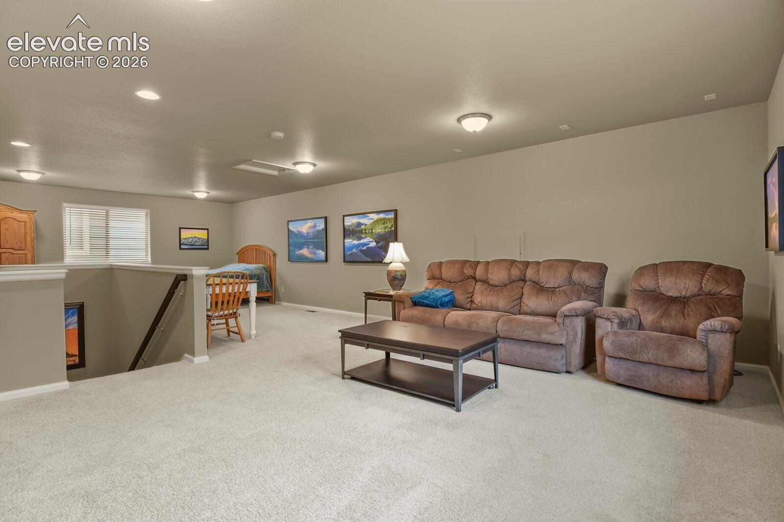 33'x17' Family Center, Open floor plan featuring wall-to-wall carpeting, recessed lighting, and Perfect Flex Space for Game Room, Media Center, Gym