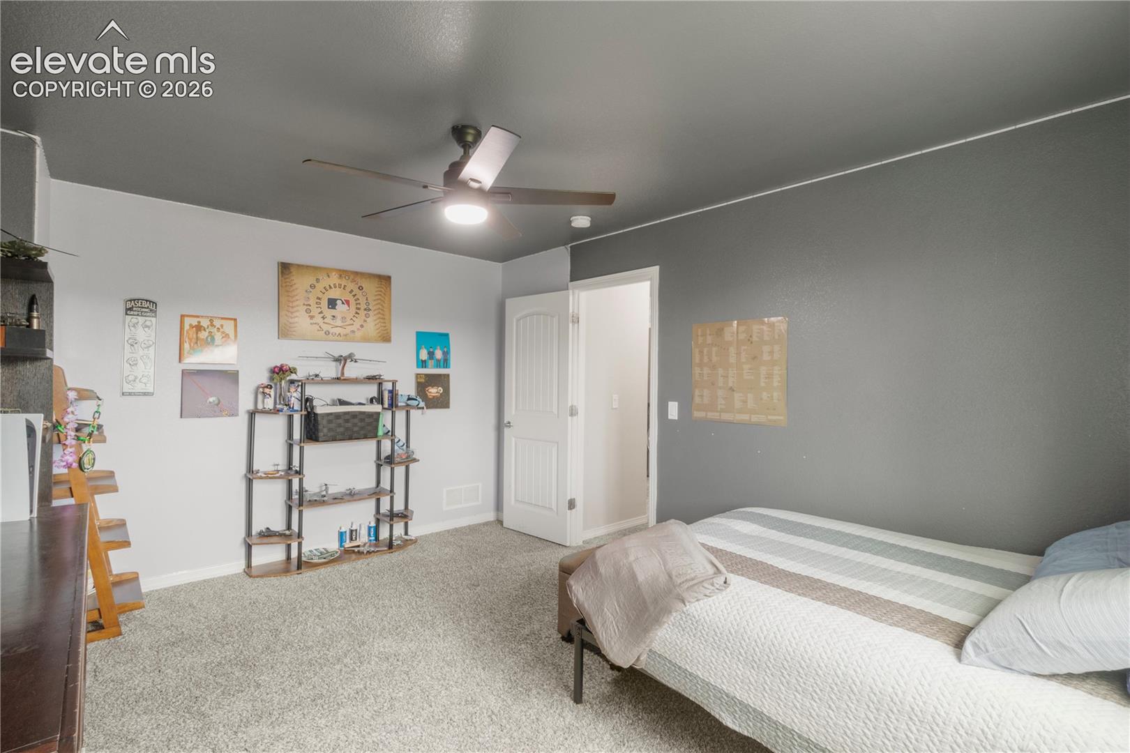 Recessed lighting, ceiling fan, and light gray carpeting