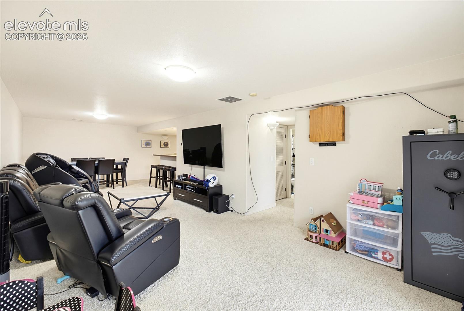 Recessed lighting and ceiling-mounted fixtures illuminate the space
