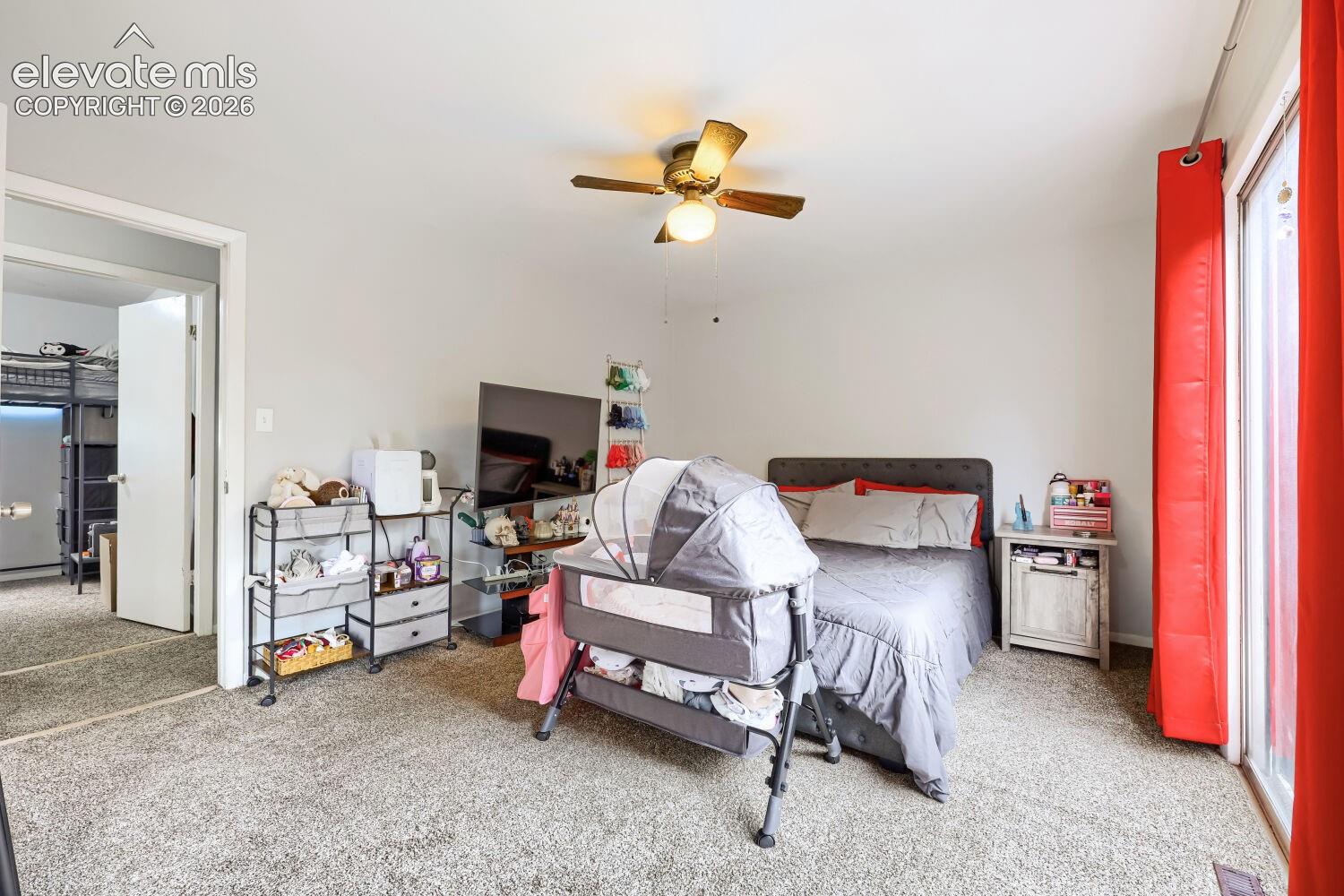 Carpet flooring and a ceiling fan with integrated lighting