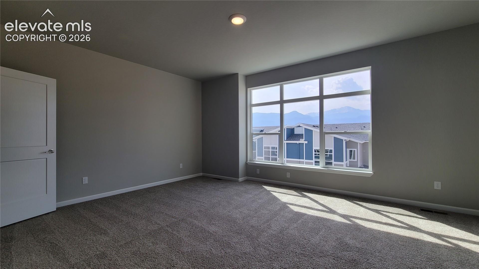Primary Suite is accompanied with a plush bathroom, walk-in closet, composite deck, and Views! 
