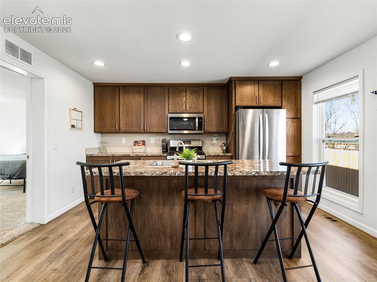 Beautiful kitichen with stainless appliances and a pantry