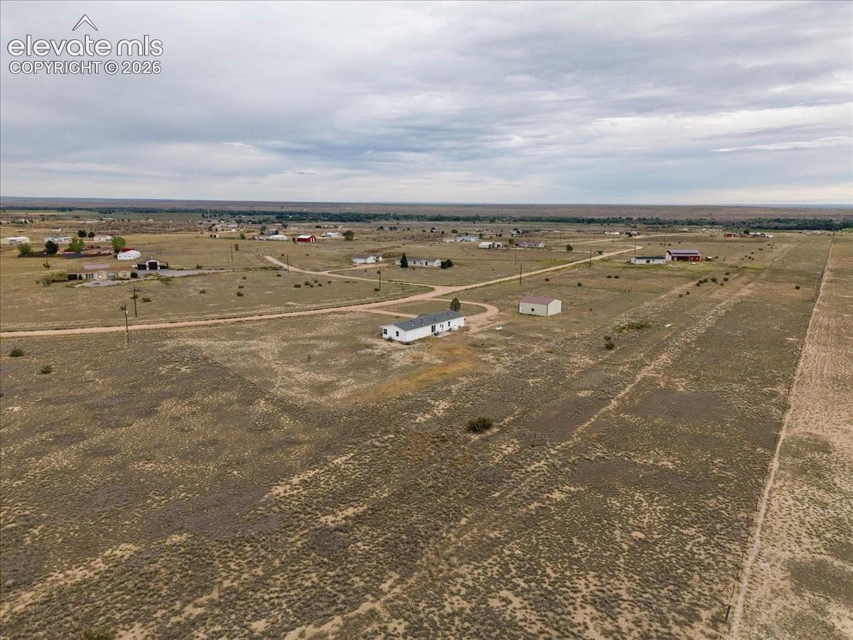Expansive surrounding land with scattered buildings