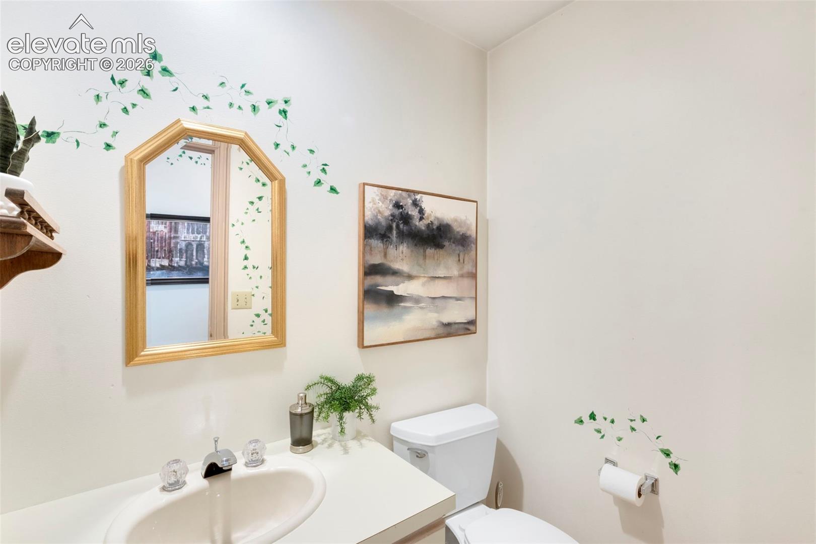 1/2 bath in laundry area, by garage and workshop