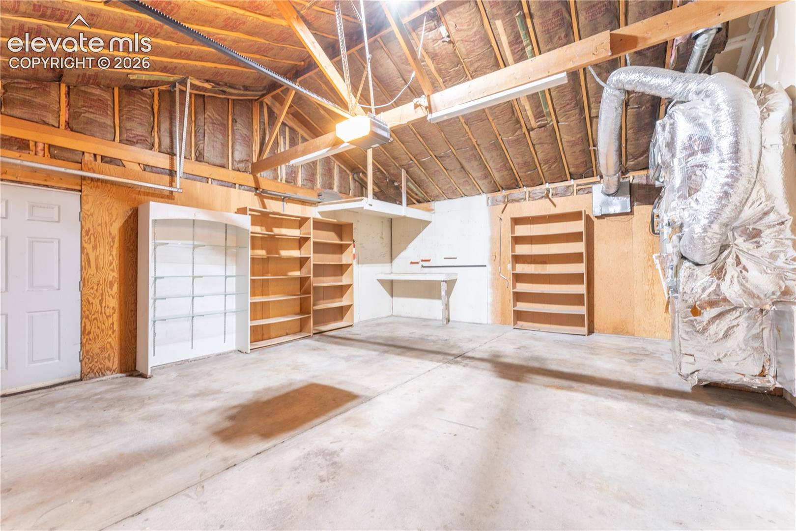 Concrete flooring with exposed wood beam ceiling