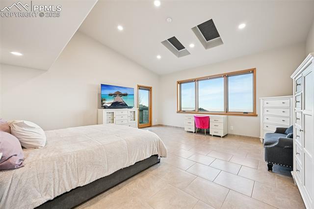 Primary bedroom with its own private walk out, en suite 5 piece bathroom, sitting area and skylights