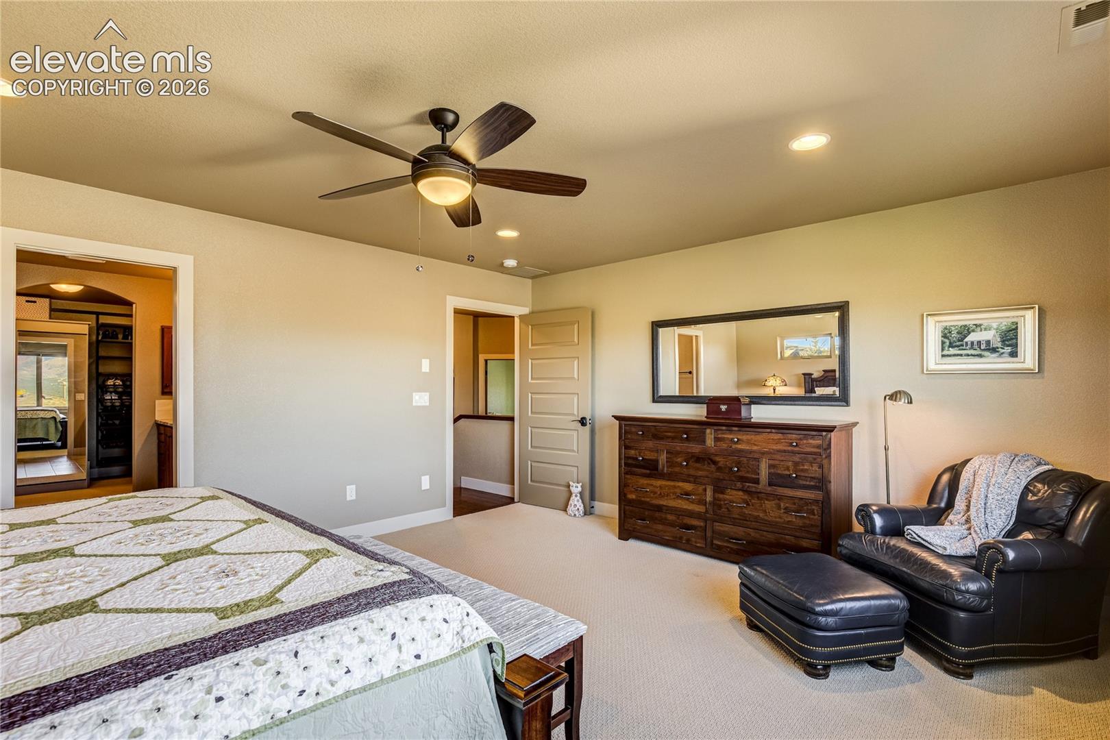 Thoughtfully proportioned for relaxation, the primary suite offers ample room for a sitting area, soft natural light + convenient access to the spa-inspired bath and spacious walk-in closet with custom organization.