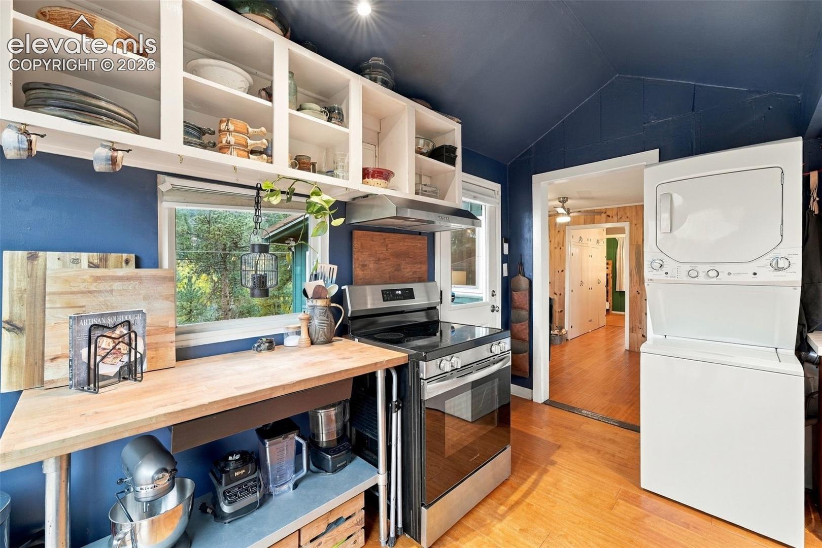 Kitchen with washer dryer combo.
